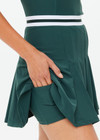 THE UPSIDE women's green Peached Lucette Pleated Dress is made in a recycled soft peached fabric with a brushed handfeel for a breathable and quick drying effect. The panelled mini dress is fitted with a pleated skirt and straight back straps with a scooped neckline for style and built in shorts and internal shelf bra for practicality and comfort. Designed for Tennis.