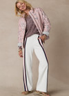 THE UPSIDE women's white Pacific Wide Leg Cody Pant is made from organic cotton. The track pant features pockets and elastic waistband. Designed for tennis and pickleball.