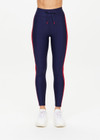 THE UPSIDE women's navy Oxford 25 inch Midi Pant is made from eco tech performance fabric. The gym leggings features red side stripes detailing. Designed for high impact workouts.