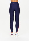 THE UPSIDE women's navy Oxford 25 inch Midi Pant is made from eco tech performance fabric. The gym leggings features red side stripes detailing. Designed for high impact workouts.