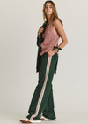 THE UPSIDE women's dark green Monte wide leg, high waisted trackpant features an elastic waistband, side stripes, and front and back pockets.