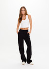 THE UPSIDE women's black Monte Pant is made from a lenzing viscose soft suiting fabrication. This high waisted wide leg pant features an elastic waistband, stripe tape down the side seams, and side seam and back patch pockets. Designed for leisure and recovery.