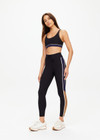 THE UPSIDE women's black Revolver 25 inch Midi Pant is made from recycled rib. The mid rise legging features drawstring at waist. Designed for the gym and high impact exercise.