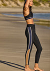 THE UPSIDE women's black Revolver 25 inch Midi Pant is made from recycled rib. The mid rise legging features drawstring at waist. Designed for the gym and high impact exercise.