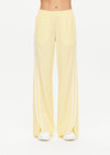THE UPSIDE women's butter yellow Juliet Low Waist Trackpant is made from a slinky, lightweight fabric and feature side stripes, pockets and a split flared hem.
