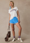 THE UPSIDE women's blue 70s style Wrangler Callie Run Short is made from recycled mesh fabric and features an internal short, elastic waist and side pockets.