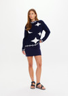 THE UPSIDE women's navy Eternity Clyde boxy Knit Crew Sweater is made with organic cotton and features cream detailing of stars and moons.