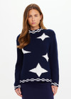 THE UPSIDE women's navy Eternity Clyde boxy Knit Crew Sweater is made with organic cotton and features cream detailing of stars and moons.