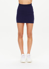 THE UPSIDE women's navy Eternity Zelma Knit Mini Skirt is made with organic cotton and features cream side stripes and mini splits at the hem.