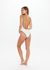 THE UPSIDE women's cream Poolside Gossip Scoop One Piece is made from recycled fabric. The one piece features front and back scoop neckline. Designed for swim.