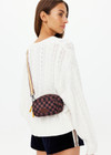 THE UPSIDE women's recycled fabric black and chocolate check Technica Voyage Crossbody Bag features multiple pockets with zippers, plus an adjustable and removable stripe strap.