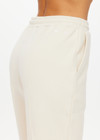 THE UPSIDE women's white organic cotton Hamilton Aries Track Pant is designed for a regular fit and features elasticated waistband and side seam pockets. Perfect for everyday.
