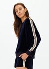 THE UPSIDE women's navy Monaco Lisel Crew Neck Sweater is a soft recycled velour fabric in a relaxed fit with a dropped shoulder. The perfect travel or everyday piece.