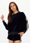 THE UPSIDE women's navy Monaco Lisel Crew Neck Sweater is a soft recycled velour fabric in a relaxed fit with a dropped shoulder. The perfect travel or everyday piece.