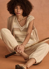 THE UPSIDE women's creme organic cotton Nikko V Neck Knit Vest is designed for an oversized fit and features a deep V neckline. Made for everyday.