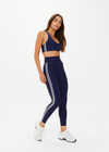 THE UPSIDE women's navy recycled peached Daytona 25 inch Legging is designed for a high-rise supportive fit and features contrast cream binds. Perfect for yoga.