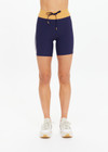 THE UPSIDE women's navy recycled peached Daytona 6 Inch Spin Short is designed for a mid-rise fit featuring contrast cream binds. Made for yoga & pilates.
