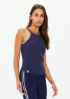 THE UPSIDE women's navy organic cotton Asher Racerback Tank Top is designed for a slim fit and features a racerback shape and high neckline. Ideal for layering & pilates.