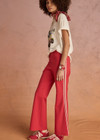 THE UPSIDE women's red Muse Flare Pant is designed for a mid to low rise fit with side seam pockets in a soft suiting fabrication. The perfect everyday or travel pant.
