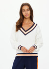 THE UPSIDE women's white organic cotton Josette V Neck Knit Sweater features a striped cable neckline in orange and navy. Made for everyday leisure.