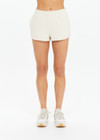THE UPSIDE women's creme organic cotton Hamilton Dee Short is designed for a regular fit, featuring a elasticated waistband with side seam pockets. Made for everyday.