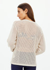 THE UPSIDE women's creme organic cotton Josephine V Neck Knit is a lightweight open knit designed for a relaxed fit with a deep V neckline. Made for everyday.