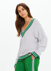 THE UPSIDE women's grey marle organic cotton Josette V Neck Knit Sweater is a regular fit and features cable detailing through front and a green striped neckline. Made for lifestyle.