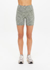 THE UPSIDE women's green Reversible 5inch Spin Short is designed for a soft & supportive fit in a recycled fabric and features embroidered arrow logo on back. Made for yoga & pilates.