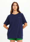 THE UPSIDE women's navy organic cotton Sammi Tee is an oversized fit and features The Upside logo on front and a printed palm tree sunset design on back. Made for lifestyle.