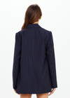 THE UPSIDE women's navy pinstripe merino Wool Boyfriend Blazer is a fully lined single breasted blazer with branded tortoiseshell buttons. Lean into a polished kind of comfort with our Wool Boyfriend Blazer.
