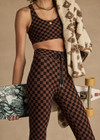 THE UPSIDE women's recycled peached black and chocolate check Technica Jade Bra is a full coverage sports bra with extra support and includes removable cups. Perfect for yoga, pilates & barre.