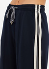 THE UPSIDE women's black Empire Marnie Wide Leg Pant is high-waisted and features a elasticated waistband with drawcord and side pockets. Made for lifestyle.