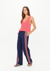THE UPSIDE women's navy Ananda Wide Leg Cody Pant is a true-to-size fit and features an elasticated waistband, side pockets and knitted stripes down sleeves. The perfect everyday piece.