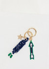 THE UPSIDE navy Arrow Keyring features a gold metal star and macrame paracord in classic navy and white, finished with rubber-dipped ends.