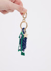 THE UPSIDE navy Arrow Keyring features a gold metal star and macrame paracord in classic navy and white, finished with rubber-dipped ends.