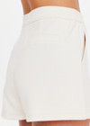 THE UPSIDE women’s cream cotton Penny Tilly Short is a low-rise style with a structured waistband and branded tortoiseshell button closure. Made for everyday wear.