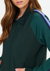 THE UPSIDE women’s green Maneki Pari Zip Jacket in Lenzing viscose features a zip-through design with striped knit tape down the sleeves. Made for everyday leisure.