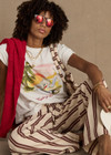 THE UPSIDE women's organic cotton creme Feeling Lucky Jodhi Tee features a classic shape and Feeling Lucky graphic printed on the front chest. Made for everyday wear.