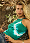 THE UPSIDE women's green organic cotton Asher Racerback Tank Top is hand-dyed in punchy green with arrow logo piping on hem. Made for lifestyle.
