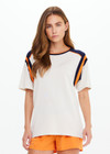 THE UPSIDE women's cream cotton Elixir Seven Tee is designed for a relaxed fit and features orange and navy stripes on neckline and shoulders. Made for everyday wear.