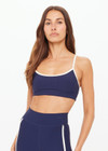 THE UPSIDE women’s navy recycled peached Samara Bowie Bra offers a soft & supportive fit and features a scooped front neckline with crossback and removable cups. Made for yoga & pilates.