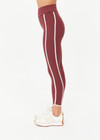 THE UPSIDE women’s red recycled peached Samara 25inch Legging is a soft & supportive fit and features side pockets and contrast cream stripes with curved hem detail. Made for pilates.
