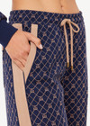 THE UPSIDE women's jacquard Ezra Nova Flare Pant features a monogram geometric design and an elasticated waistband with drawcord. Made for lifestyle.