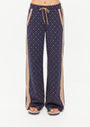 THE UPSIDE women's jacquard Ezra Nova Flare Pant features a monogram geometric design and an elasticated waistband with drawcord. Made for lifestyle.