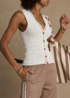 THE UPSIDE women's creme Rosella V Neck Vest has a slim fit with tortoiseshell button closure and beige striped ribbing along the neckline and front. Made for lifestyle.