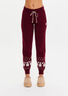 THE UPSIDE women’s maroon organic cotton Le Ski Jojo Knit Jogger features a soft knitted waistband with braided tassel drawcord, side pockets and snowflake design at ankles. Designed for Après-ski and winter wear.