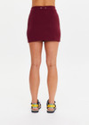 THE UPSIDE women’s recycled maroon Adesa Zelma Knit Mini Skirt features a cream stripe along the side. Made for lifestyle.