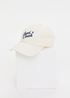 THE UPSIDE women’s cream Good Luck Soft Cap features an embroided 'Good Luck' on front with an adjustable strap at the back.