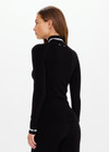 THE UPSIDE women’s black merino Wool Seamless Base Quarter Zip offers a soft & comfortable fit and features white striped ribbing on cuffs and collar. Designed for Après-ski and winter wear.