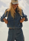 THE UPSIDE women’s blue denim Lykke Lexi Bomber Jacket, in a soft chambray fabrication, is made for a relaxed fit. This zip-through jacket features front pockets with branded tortoiseshell buttons.